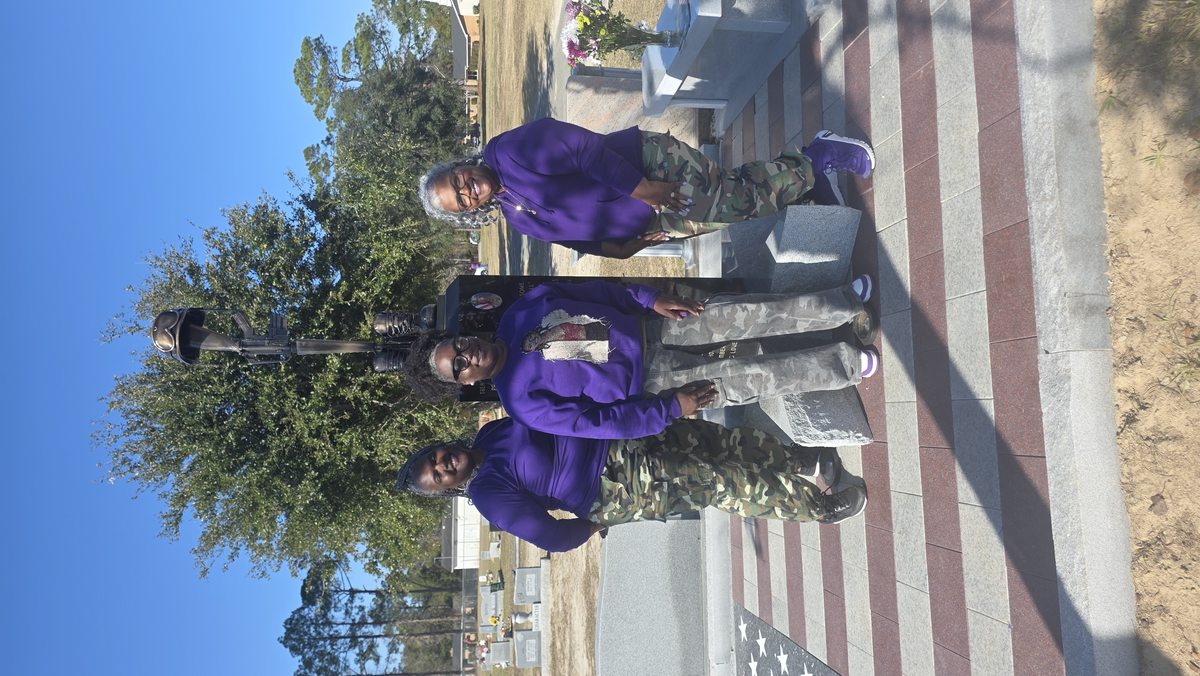 Family standing at Sgt. Kennedy L. Sanders Memorial Monument