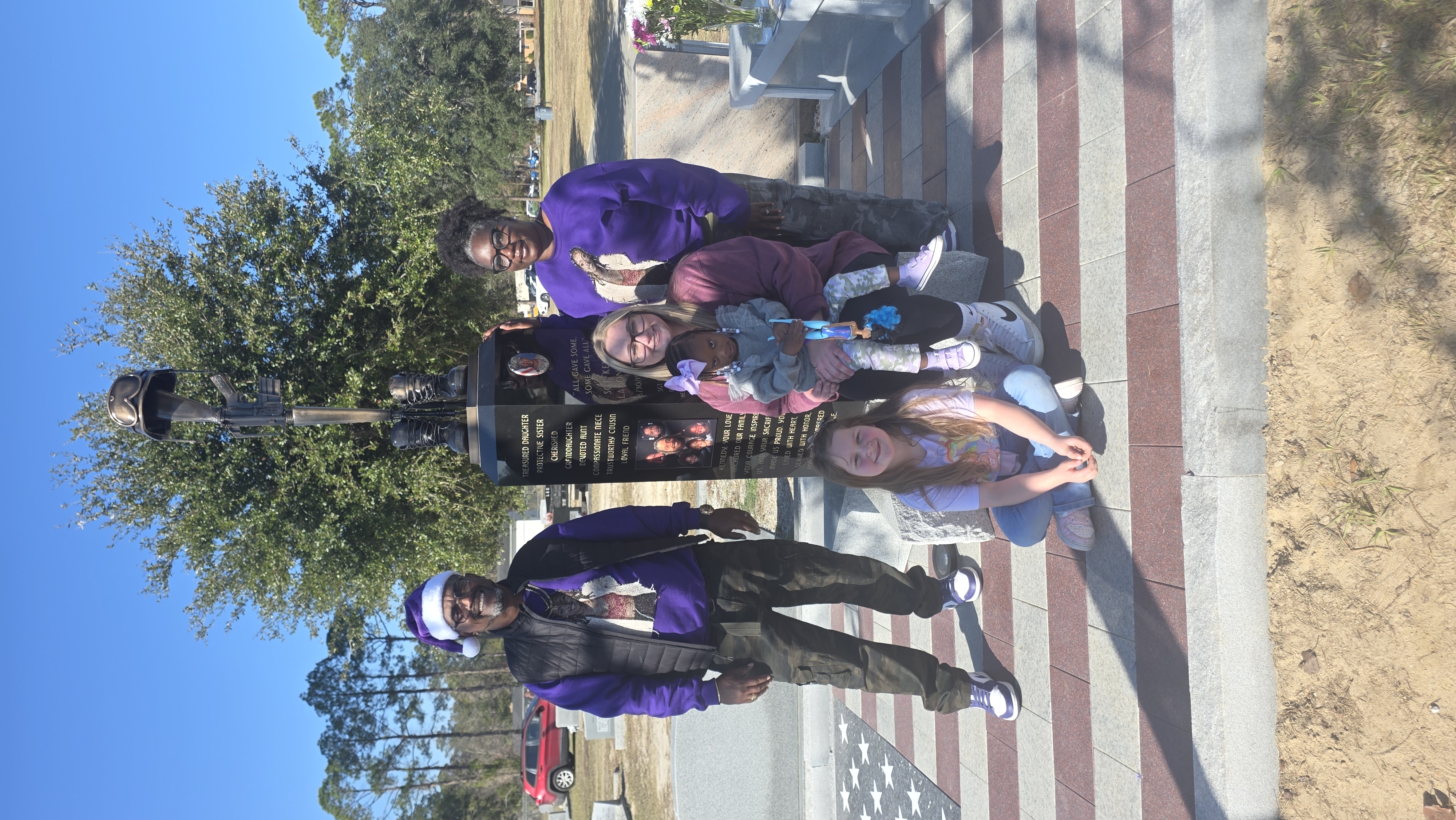 Visitors honoring Sgt. Kennedy L. Sanders Memorial Monument