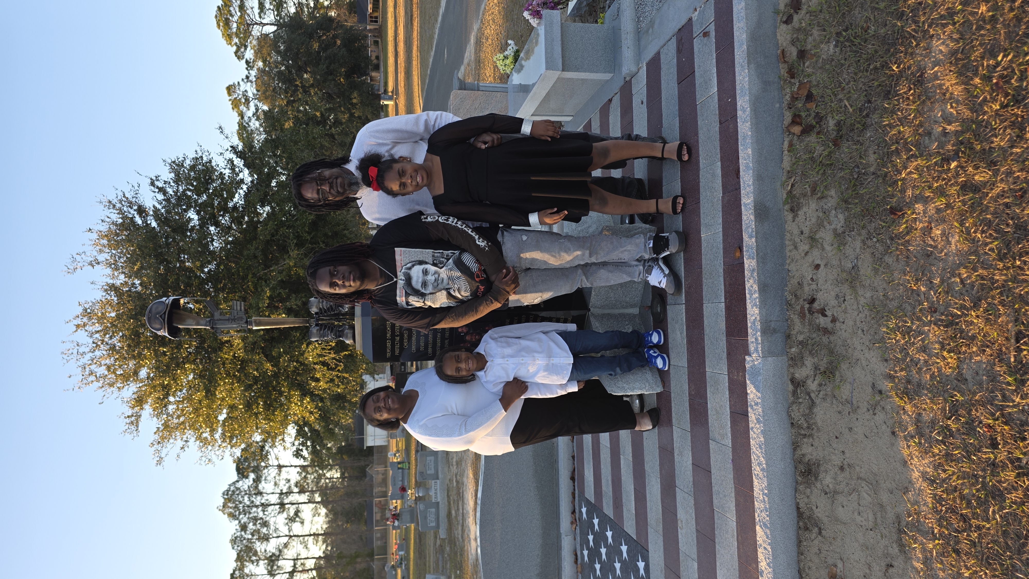 Family gathered at Sgt. Kennedy L. Sanders Memorial Monument